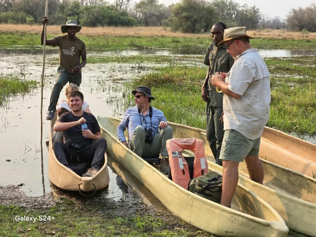 Guests exploring Botswana wetlands by mokoro with Bosele-style safari atmosphere